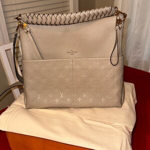 Pristine condition authentic Louis Vuitton Monogram Maida Hobo Bag